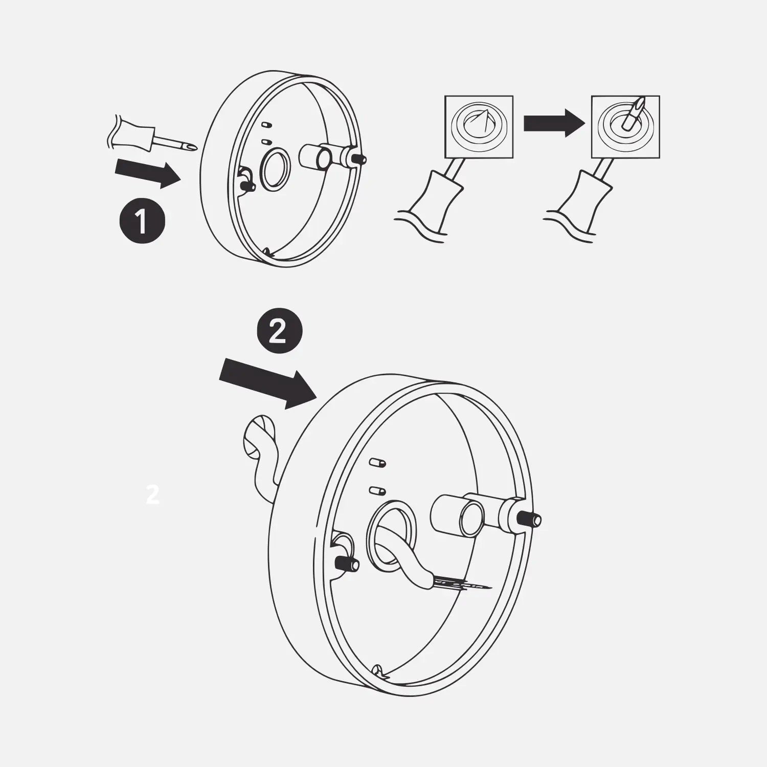 A black-and-white diagram demonstrating the process of piercing the silicone seal in the center of a wall bracket with a screwdriver and threading the wiring through the hole for installation.